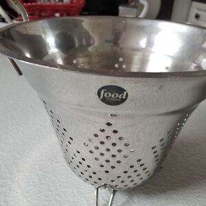 Food Network Colander. It's   NOT dented. Lighting, reflection